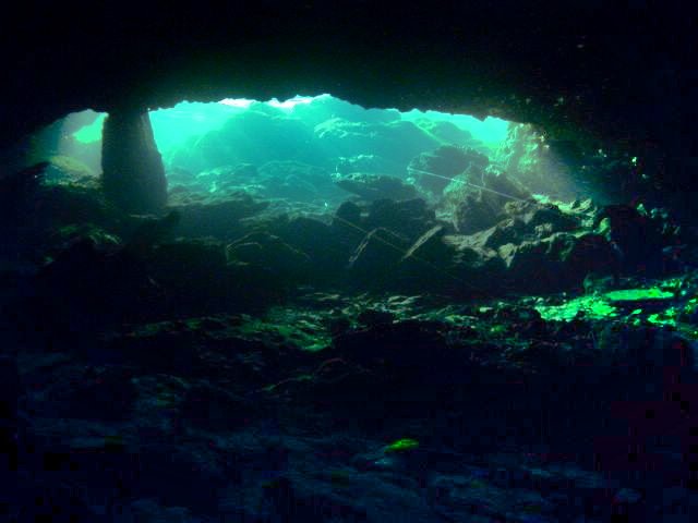 Turquoise light at the underwater cave entrance at Peacock Springs